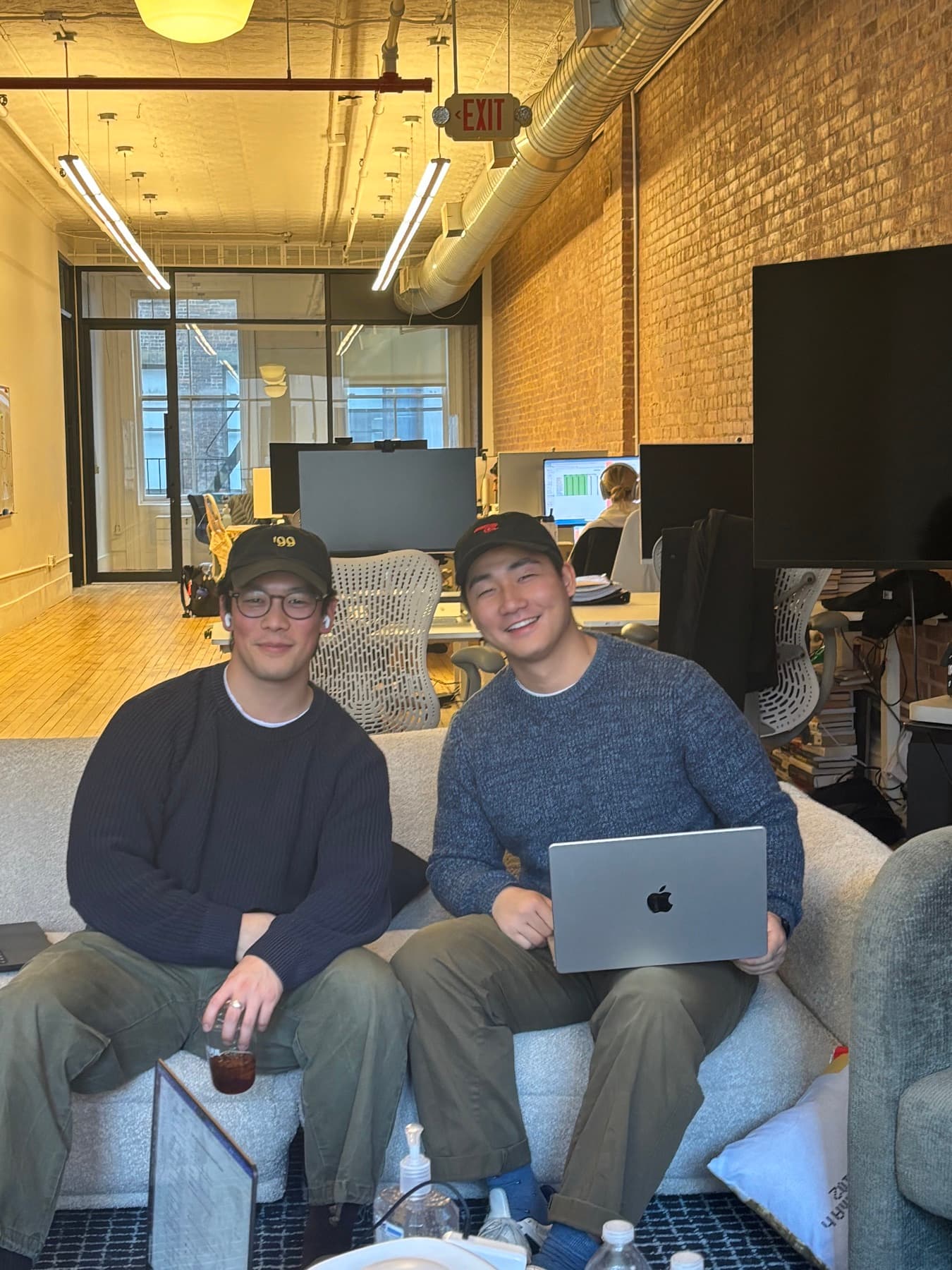 Two Zingage teammates sitting in the Soho office